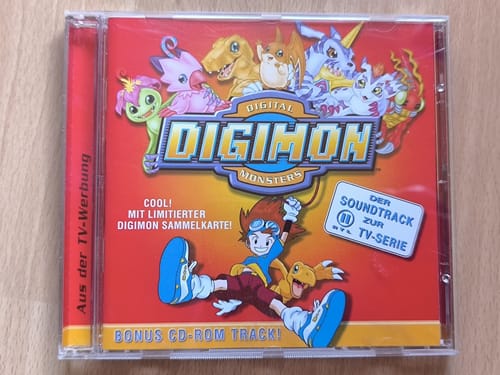 Der Soundtrack zur RTL-II-Serie, „mit limitierter Digimon-Sammelkarte" — darin lag MetallGreymon DW-01 mit eckigen Kanten